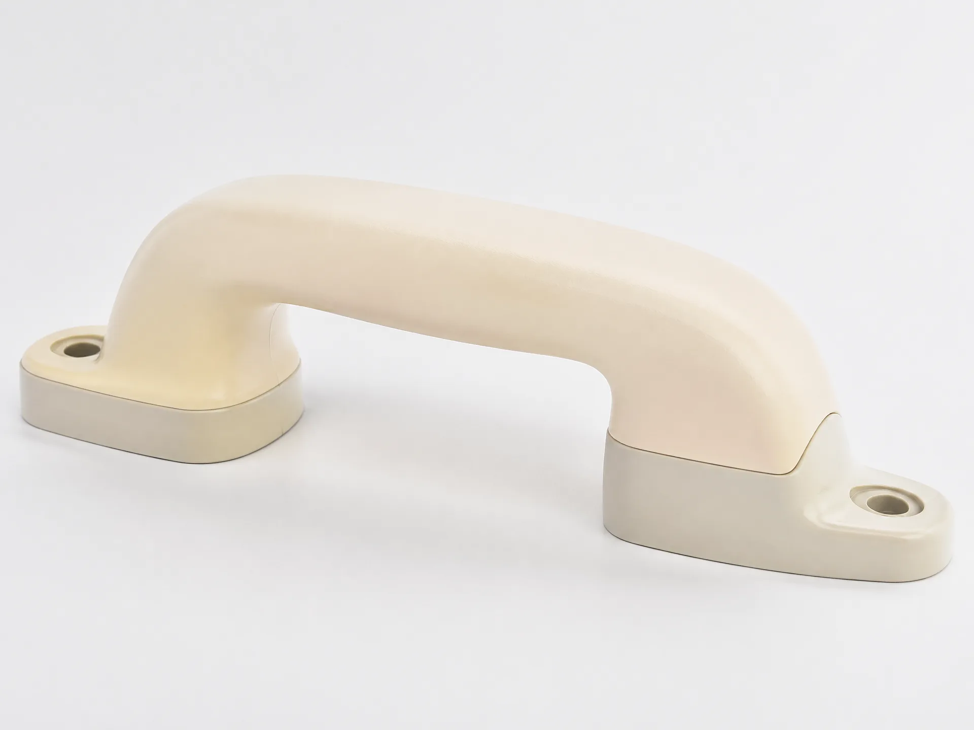 Plastic over plastic overmolding configuration on a multi-material part